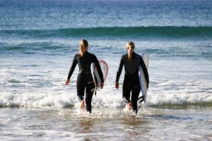 ride on retreats two women surfers