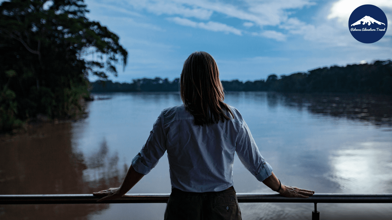 Women gazing out over the Napo River, surrounded by lush greenery and the beauty of nature - 9-Day Ecuador Amazon Female Travel - Rebecca Adventure Travel