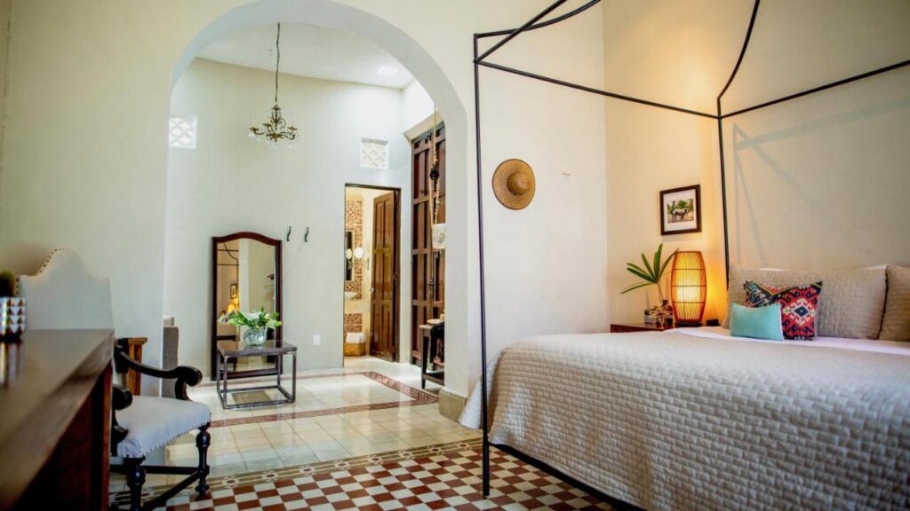 A four poster bed is just one of the highlights of this spacious and bright room at the Diplomat Hotel in Merida, Mexico, recommended by a JourneyWoman reader as a safe place for women to stay.