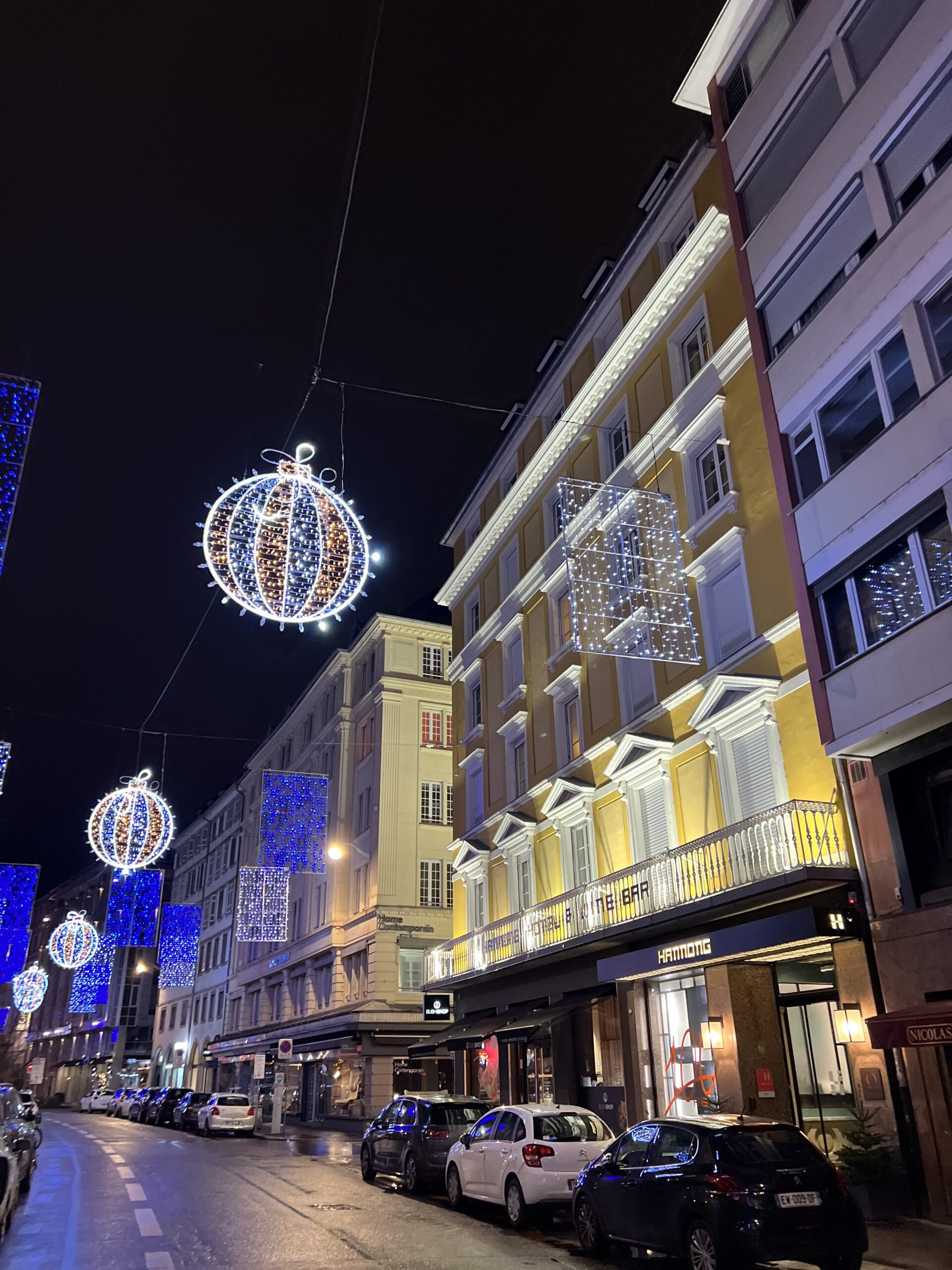 The Hotel Hannong in Strasbourg, France-shown lit up at night-is a women friendly accommodation recommended by JourneyWoman readers.