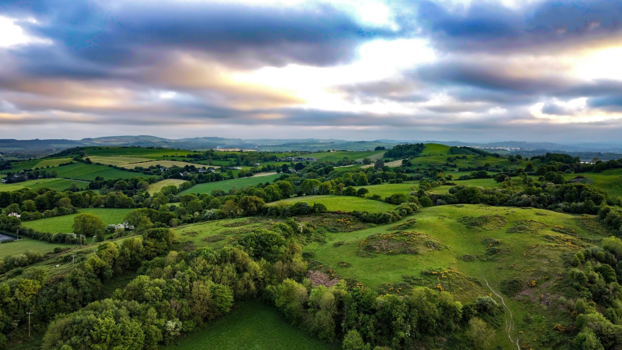 An aerial view of the rolling green fields and hills of the Irish countryside - Ireland Trail Running + Wellness Retreat Fall - Run Wild Retreats