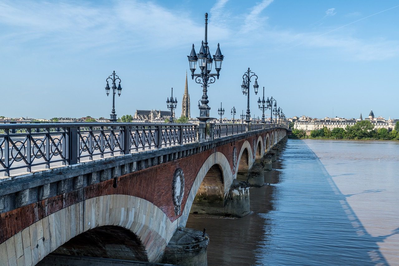 A view of the length of a bridge in Bordeaux, France to illustrate Global Palate Adventures' culinary trip in the region.