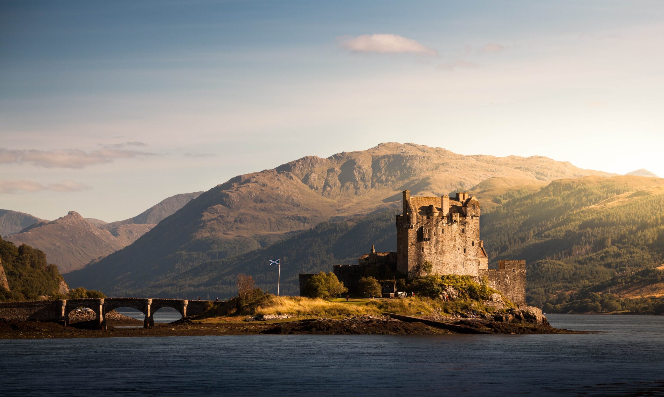 Contemplating the iconic Eilean Donan Castle that sits on an island - Ireland & Scotland’s Gems - Brendan Vacations