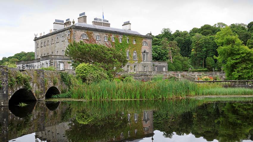 Admiring the majestic 18th century Westport House from the lake - Best of Ireland - Brendan Vacations