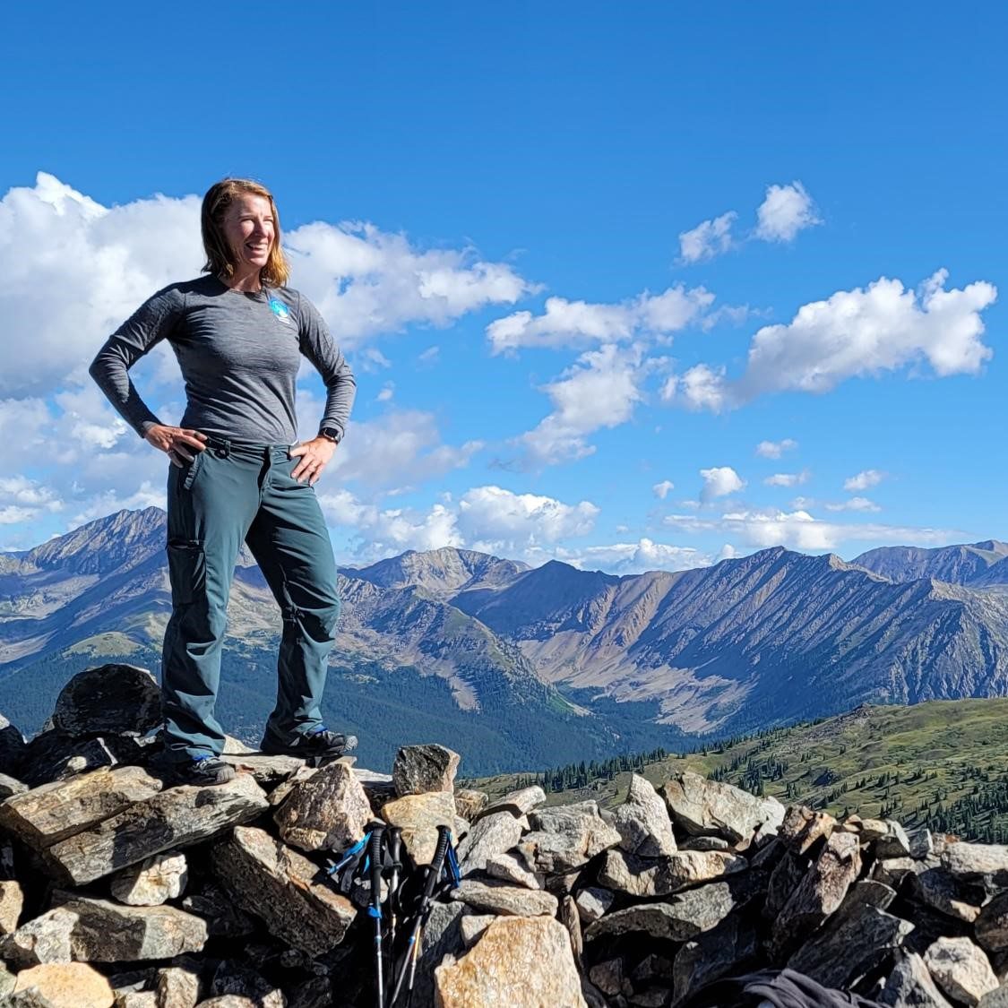Founder of Trailblazer Wellness gazes over the horizon at Cottonwood Pass - Adventure Coaching for Women