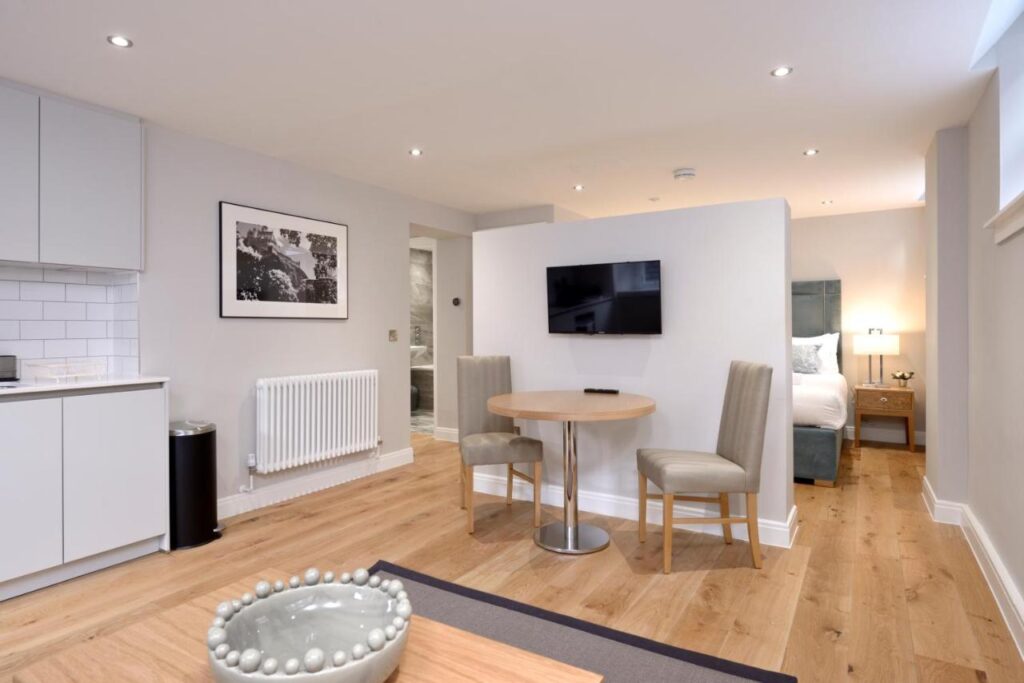An open concept apartment space at Destiny Scotland, an apartment rental in Edinburgh, recommended by a JourneyWoman reader as a safe place for women to stay.