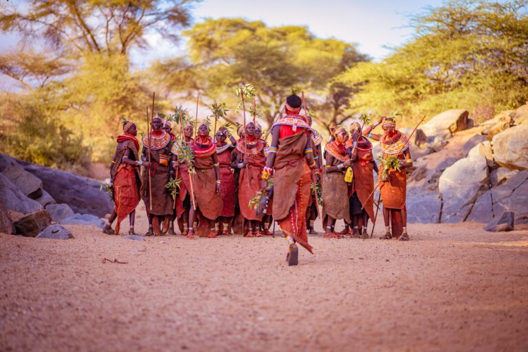 Samburu tribe members are lining up for a group photograph - Safari Retreat in Kenya - Oculus Travel