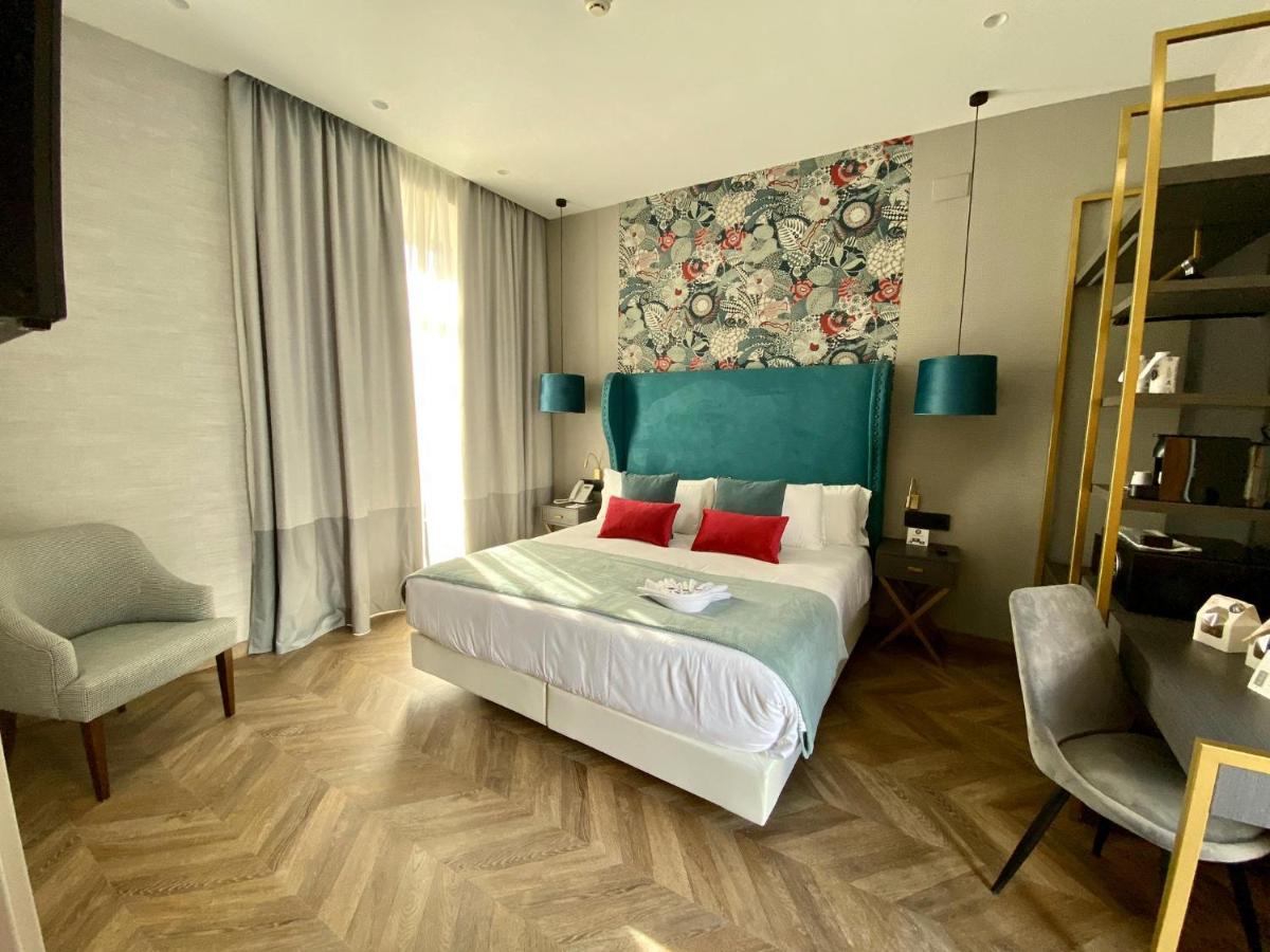 A nicely decorated room with a queen bed and modern art - Soho Boutique Sevilla in Spain, recommended by a JourneyWoman reader as a safe place to stay for women.