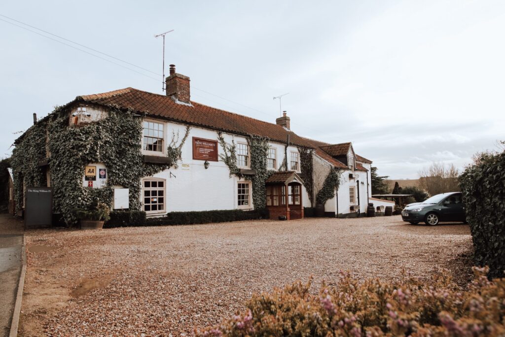 An exterior of the King Henry th IV Pub and Hotel in Sedgeford, Norfolk, England, recommended as a safe place for women to stay by JourneyWoman readers.