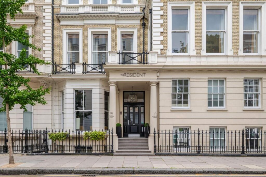 The white-brick front of the Resident Kensington hotel in London, recently recommended by a JourneyWoman reader as a safe place to stay for women.