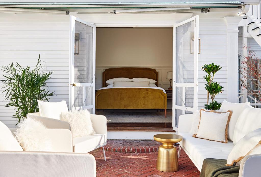 A double bed suite with walkout to patio at the Kennebunkport Captains Collection, a Lark Hotel, in Kennebunkport Maine, a safe place for women to stay.