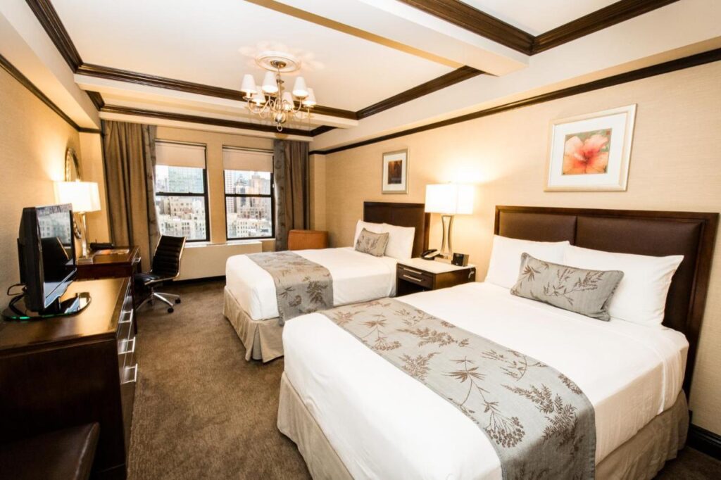 A suite with two double beds at the Belvedere Hotel in New York, recommended as a safe place for women to stay.