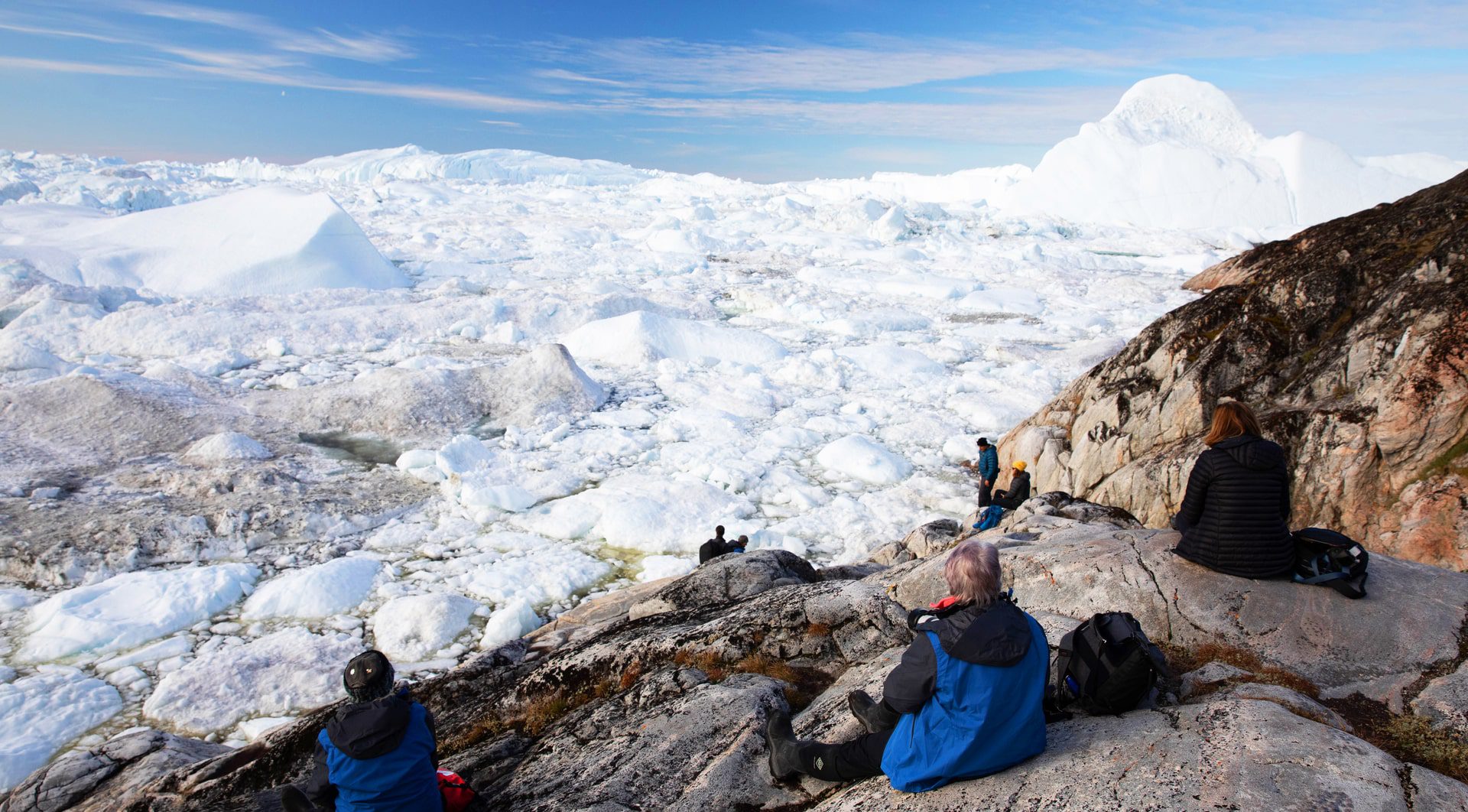 Resting at the top of a viewpoint in Ilulissat, Greenland, with stunning views of the icy landscape -