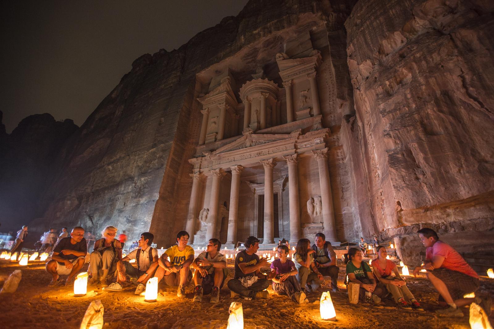 A group of travellers sitting in front of Al-Dayr