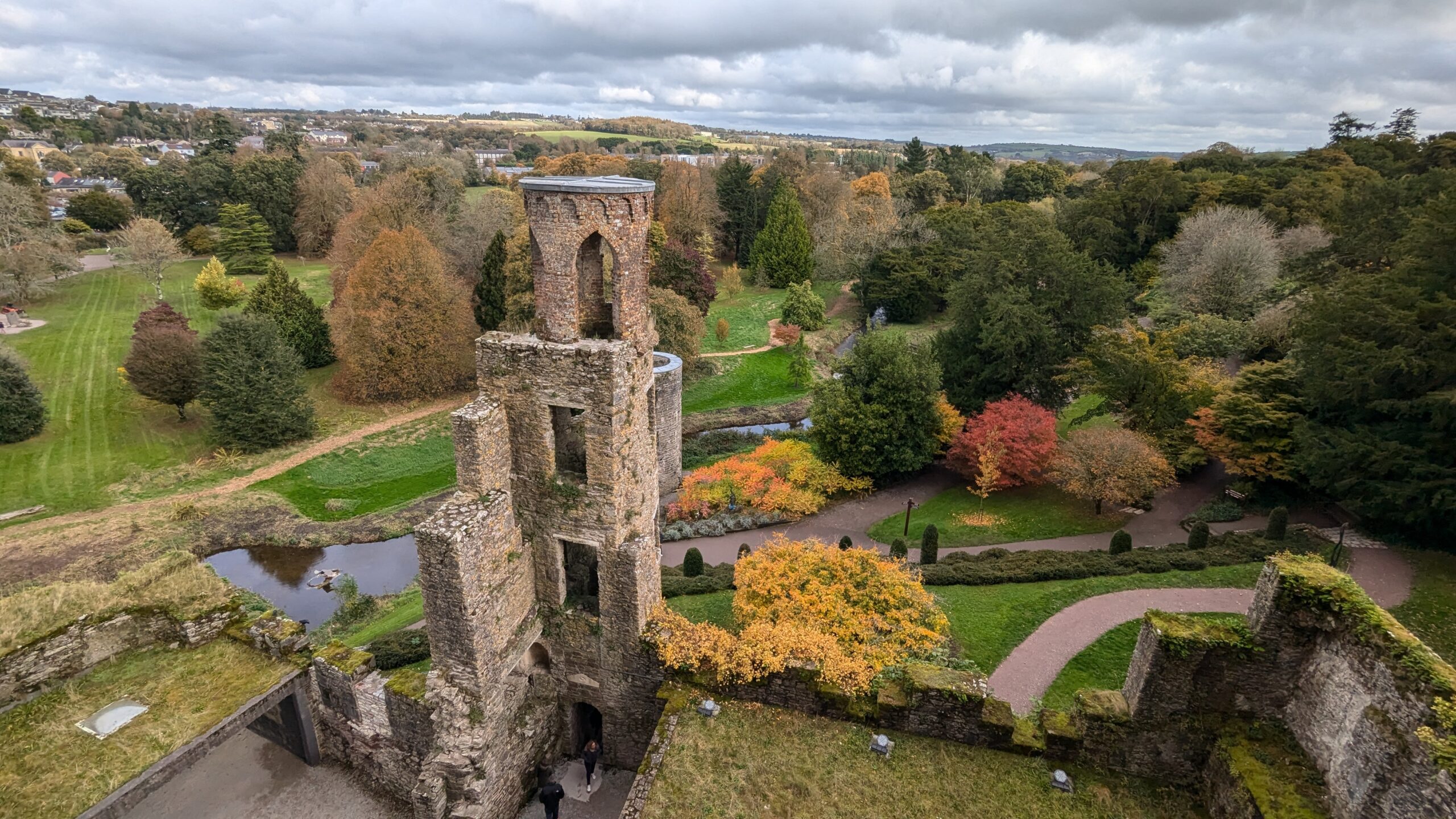 Blarney Castle, a historic medieval fortress in Ireland, visited during the Irish Splendor tour, where guests can explore its rich history and kiss the legendary Blarney Stone.