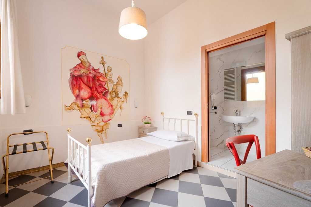 A single bed room at the Hostel Archi Rossi in Florence, Italy, recommended by a JourneyWoman readers as a safe place for women to stay.