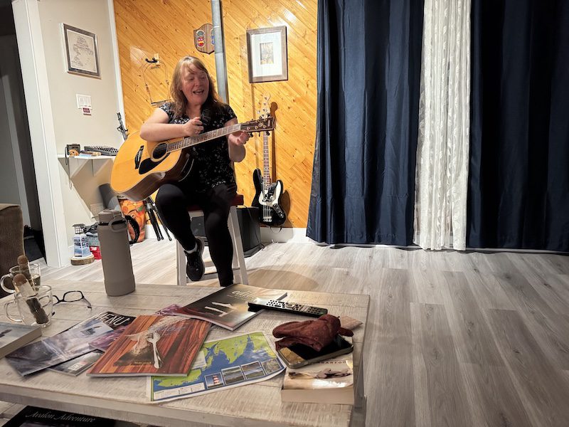 Innkeeper and musician Michelle Myrick plays for guests