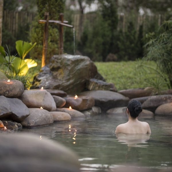 Tranquil hot spring nestled within a spa setting.