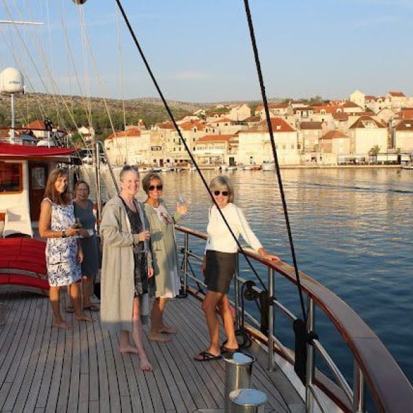 Group of women posing on the deck of a boat - Croatia: Cruise the Islands of the Dalmatian Coast AdventureWomen