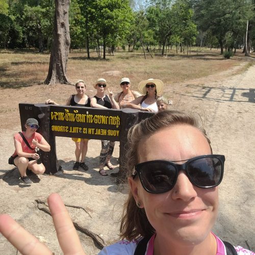 Animal Experiences International AEI Women by a sign in Asia