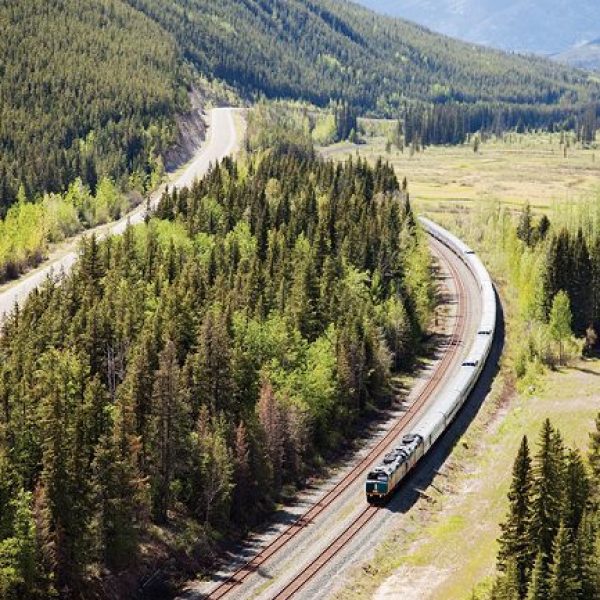 An aerial view of a Via Rail train as it passes through a low valley - the Canadian Prestige: Eastbound - Canada Rail Trips