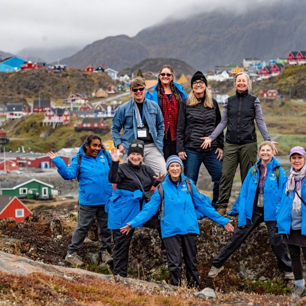 A group of tour participants exploring the breathtaking landscapes of Baffin Island and Greenland