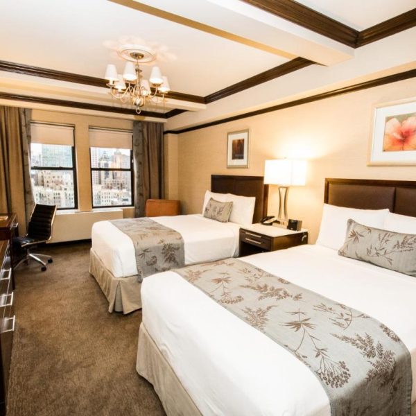 A suite with two double beds at the Belvedere Hotel in New York, recommended as a safe place for women to stay.