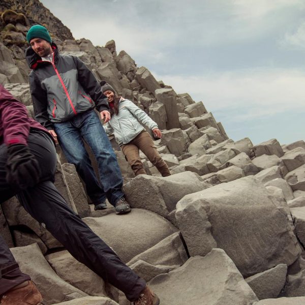 A group of travelers by the Reynisfjara beach