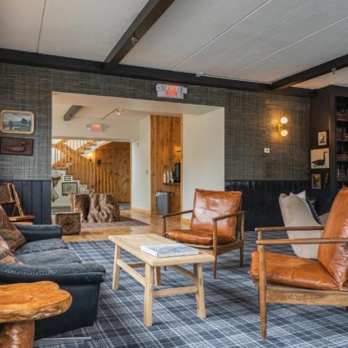 The reception area lounge at the Hunter Lodge, a Bluebird by Lark hotel in Hunter, New York, a safe place for women to stay.