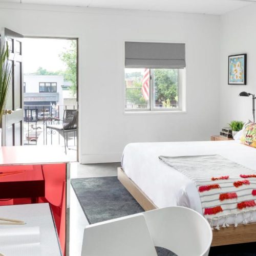 A bright, double bed room at the Bluebird Spa City Motor Lodge in Saratoga Springs, New York, a safe place for women to stay.