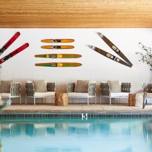 The pool area with comfortable seating at the Bluebird Sunapee hotel in New Hampshire, a safe place for women to stay.