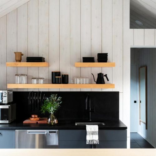 A simple, well appointed kitchen as part of a suite at the Bluebird Talta Lodge in Stowe, Vermont, a safe place for women to stay.