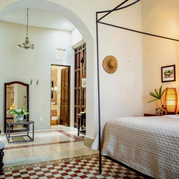 A four poster bed is just one of the highlights of this spacious and bright room at the Diplomat Hotel in Merida, Mexico, recommended by a JourneyWoman reader as a safe place for women to stay.