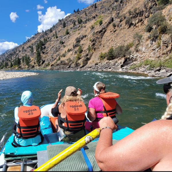 Women paddling together on a thrilling rafting adventure - Idaho Main Salmon River Rafting Tour