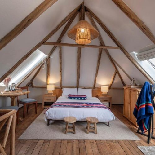 A beautiful, well-lit attic room at the Hacienda el Porvenir by Tierra del Volcan in Machachi, Ecuador, and a safe place for women to stay