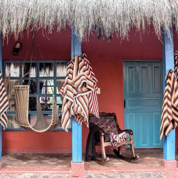 Porch of the Hacienda el Porvenir by Tierra del Volcan, a lodge in Machachi, Ecuador, and a safe place for women to stay.