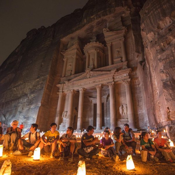 A group of travellers sitting in front of Al-Dayr