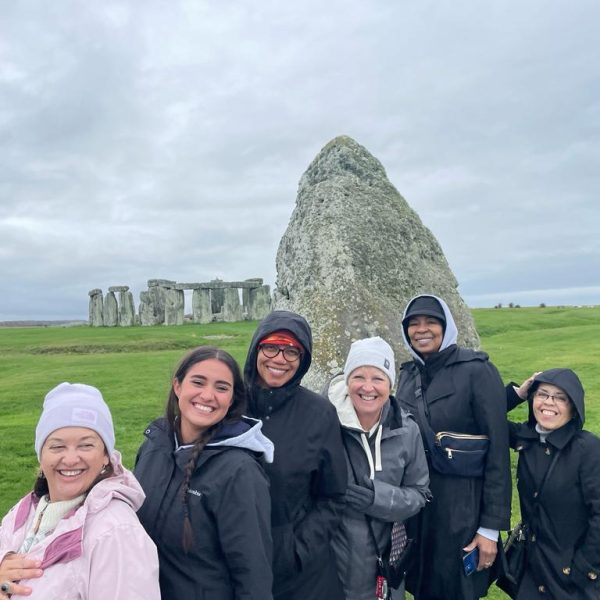 Tour participants exploring the iconic Stonehenge monument.