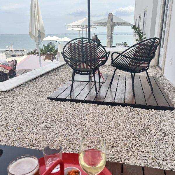 A patio with views of the coast at the Memmo Alfama Hotel in Lisbon, Portugal, recommended as a safe place for women to stay.