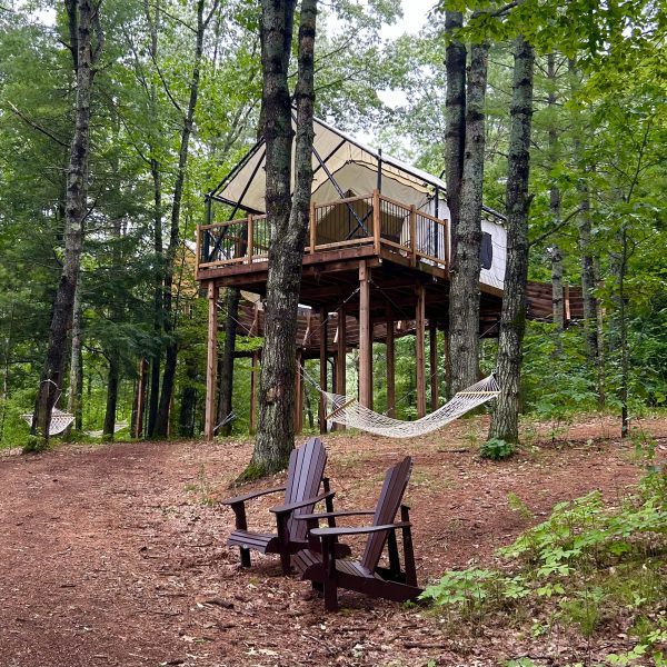 Luxurious glamping above the forest floor at Whispering Springs in Ontario, recommended as a safe place for women to stay.