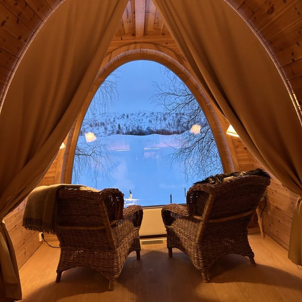 a picturesque view of the tundra from a room in at the SnowHotel Kirkenes in Norway, recently recommended as a safe place to stay for women by a JourneyWoman reader.