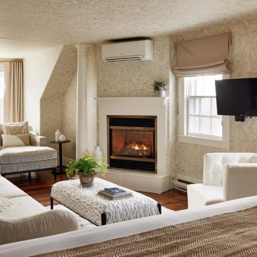 A private seating area in a suite at the Kennebunkport Captains Collection, a Lark Hotel in Kennebunkport, Maine, a safe place for women to stay.