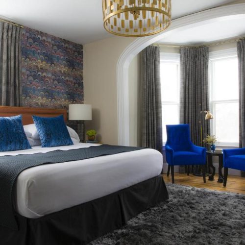 A maximalist design for a double bed suite at Gilded, a Lark Hotel in Newport, Rhode Island, and a safe place for women to stay.