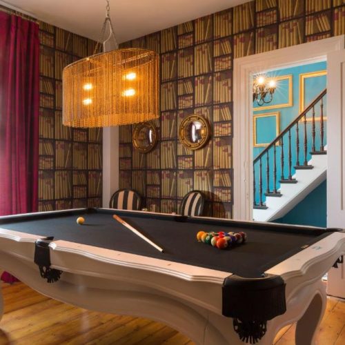 The games room complete with pool table at Gilded, a boutique Lark Hotel in Newport, Rhode Island, and a safe place for women to stay.