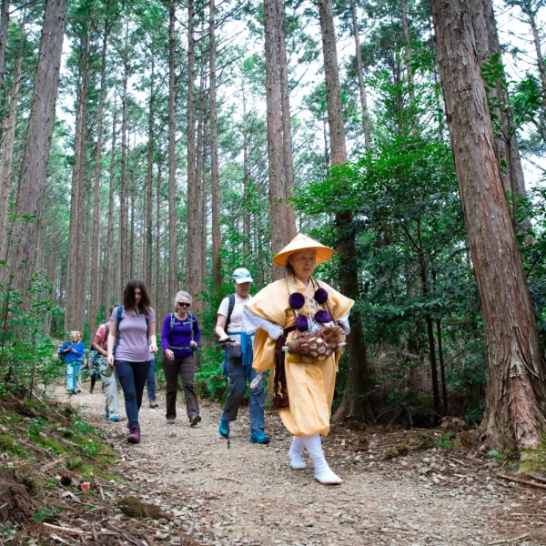 Mountain-Priestess-leading-a-walk-in-on-a-forest-trail-1312x875@2x