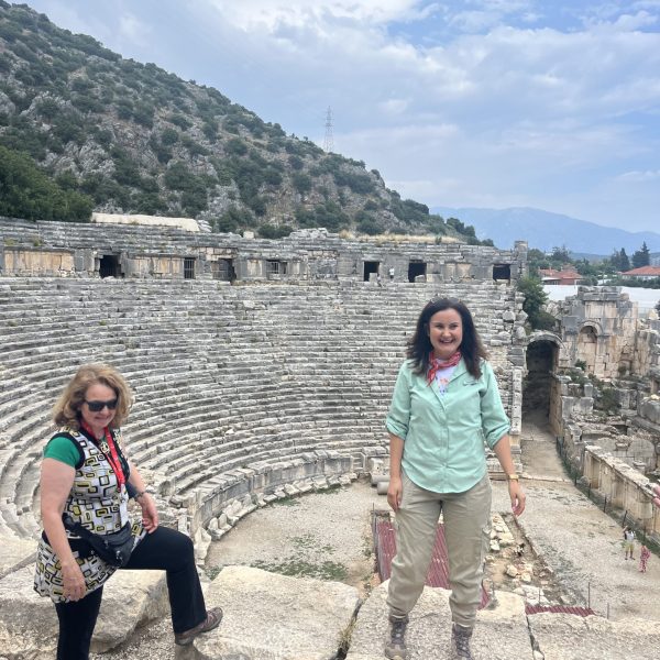 Women exploring the ancient Myra theater, a historic stop on the Western Türkiye Tour, surrounded by impressive stone ruins - Far Horizons