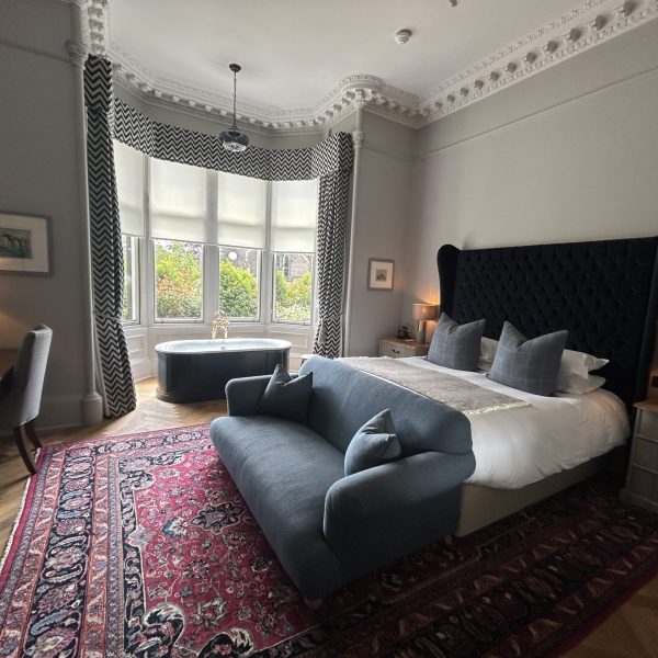 Boutique suite with bay window at the Roseate House Hotel in London, England, recommended as a safe place for women to stay.