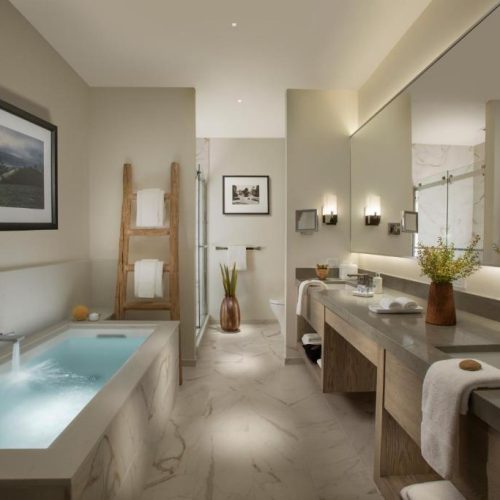 A beautiful bathroom modern soaker tub at the Stilwell by Lark Hotels in Carmel, California, a safe place for women to stay.