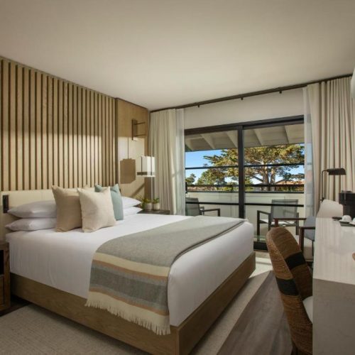 A double bed suite with walkout balcony at the Stilwell by Lark Hotels in Carmel, California, a safe place for women to stay.