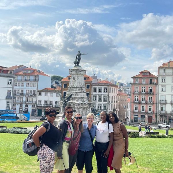 Women celebrating the end of their profound achievement of the Camino -